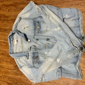 Super distressed light wash denim jacket